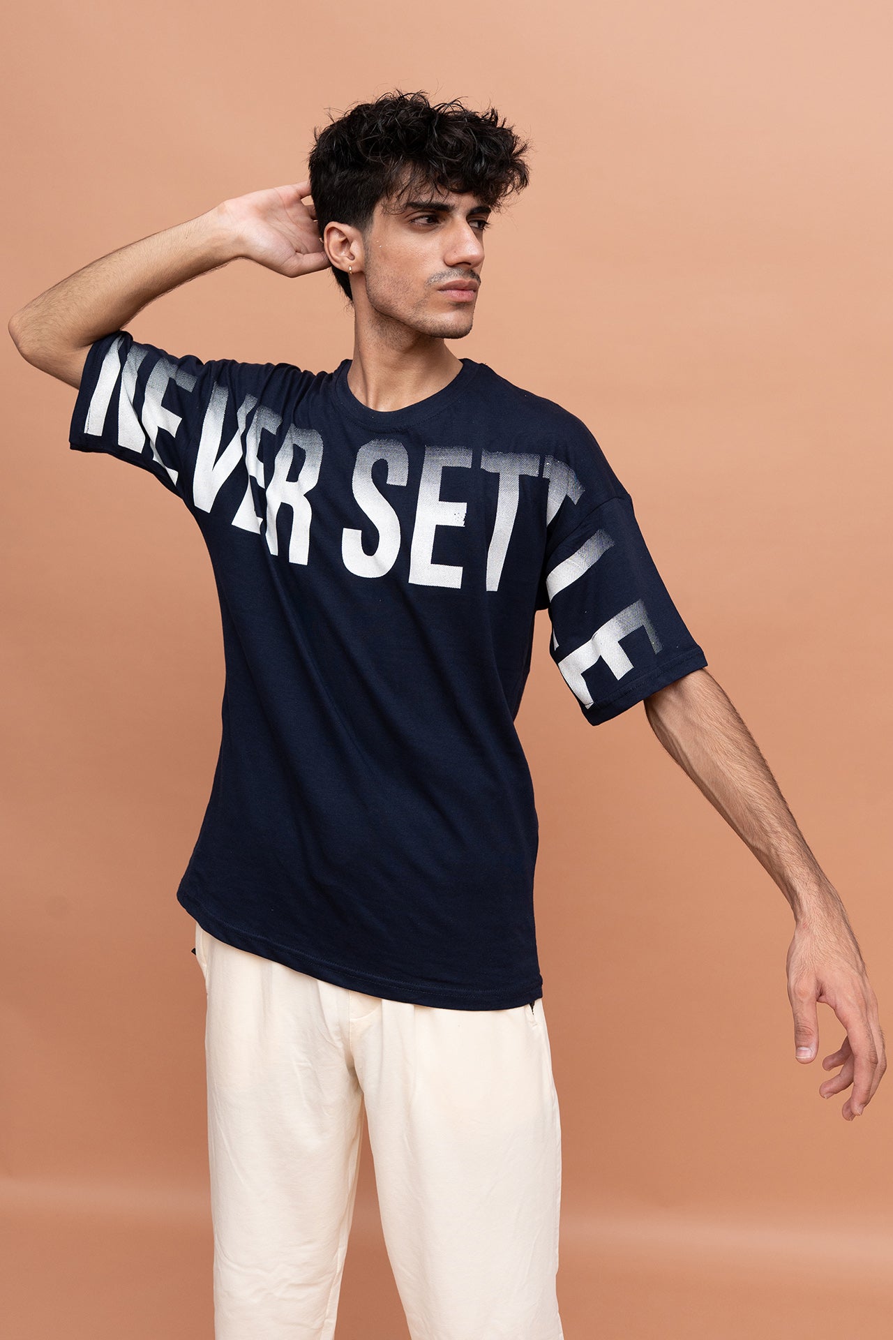 VIVE men's streetwear co-ord set featuring a down shoulder cotton jersey graphic T-shirt and loose fit trousers.